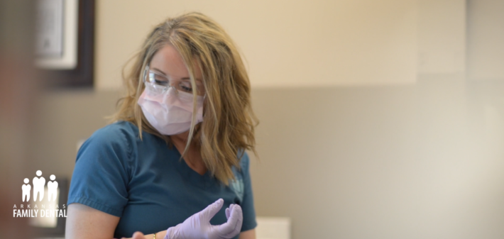 Registered dental technician Christy Stevenson prepares for a dental procedure.