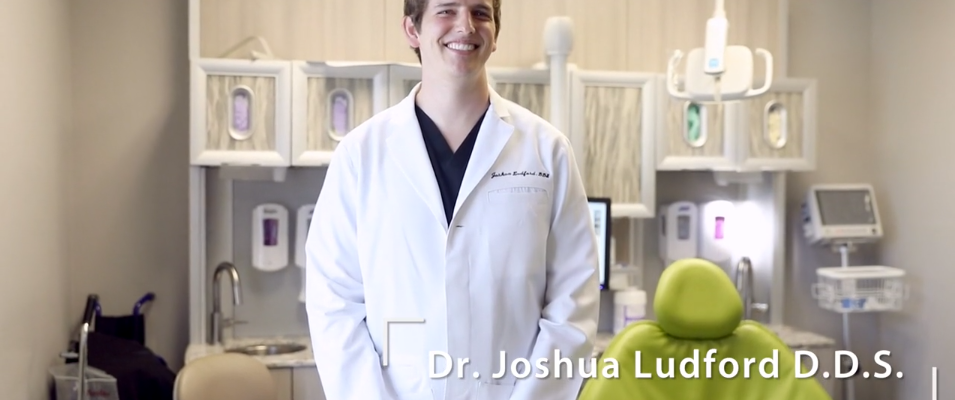 Dr. Joshua Ludford, D.D.S. stands in an Arkansas Family Dental exam room in Little Rock, AR.